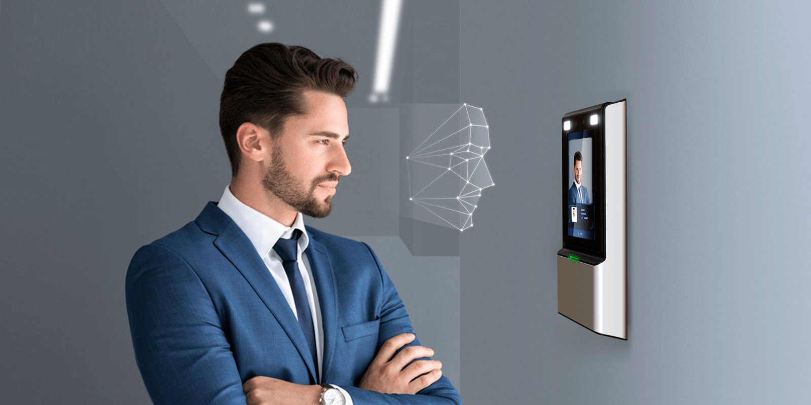 Man in suit looking at screen on wall